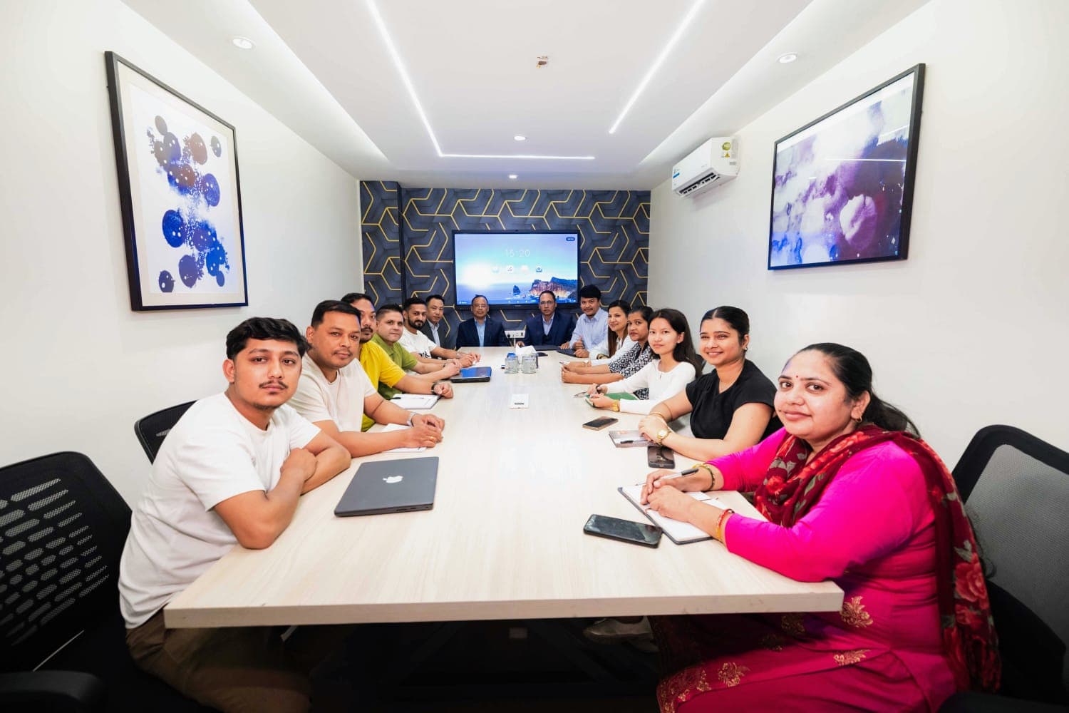 The SAS Group team in discussion at the head office boardroom